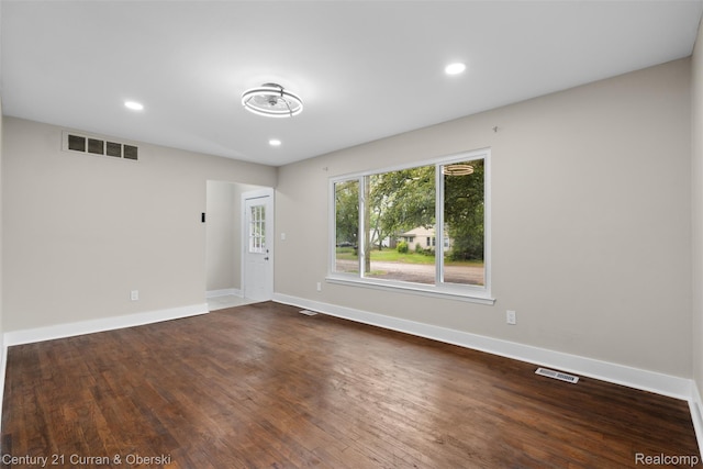 6262 Garden Ct, Warren, MI 48091 - empty room featuring dark wood-type flooring, baseboards, and recessed lighting