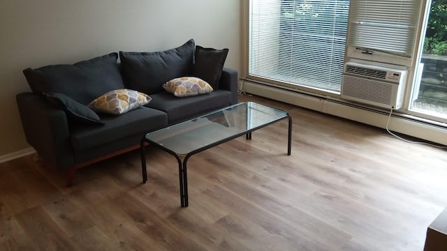 1531 Packard St Unit 2, Ann Arbor, MI 48104 - living area with wood finished floors and a baseboard radiator