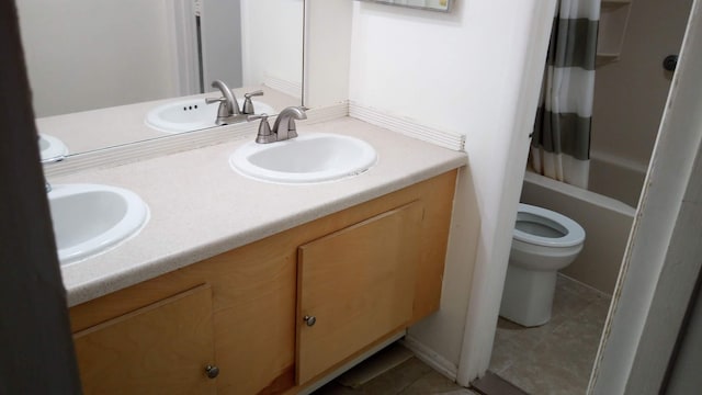 1531 Packard St Unit 2, Ann Arbor, MI 48104 - full bathroom featuring double vanity, tile patterned flooring, toilet, and shower / bathtub combination with curtain