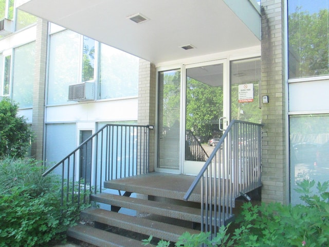 1531 Packard St Unit 2, Ann Arbor, MI 48104 - doorway to property featuring brick siding and cooling unit