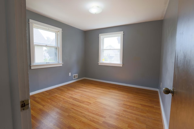 93 Illinois St, Battle Creek, MI 49014 - unfurnished room with healthy amount of natural light, light wood-type flooring, and baseboards