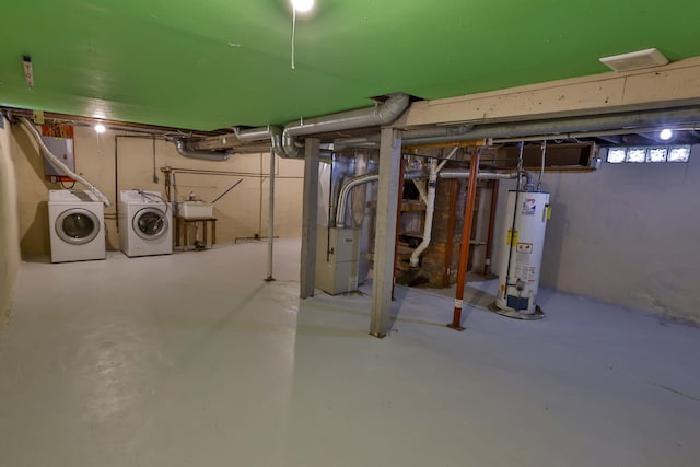 93 Illinois St, Battle Creek, MI 49014 - below grade area featuring gas water heater, washer and clothes dryer, heating unit, and a sink
