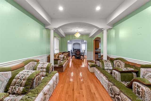 5410 Argyle St, Dearborn, MI 48126 - hall with decorative columns, arched walkways, wainscoting, light wood-type flooring, and recessed lighting