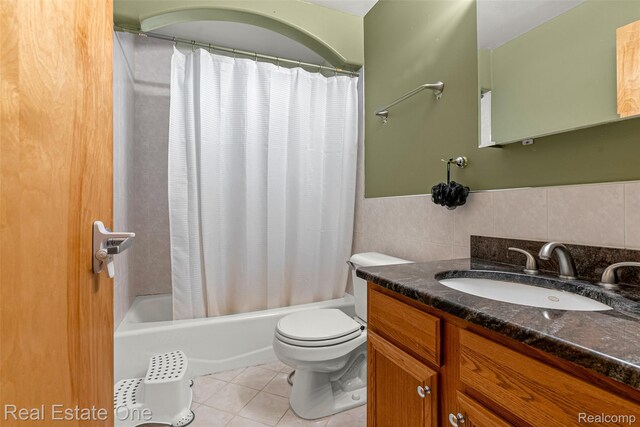 5410 Argyle St, Dearborn, MI 48126 - full bathroom with tile patterned flooring, vanity, toilet, shower / tub combo, and tile walls