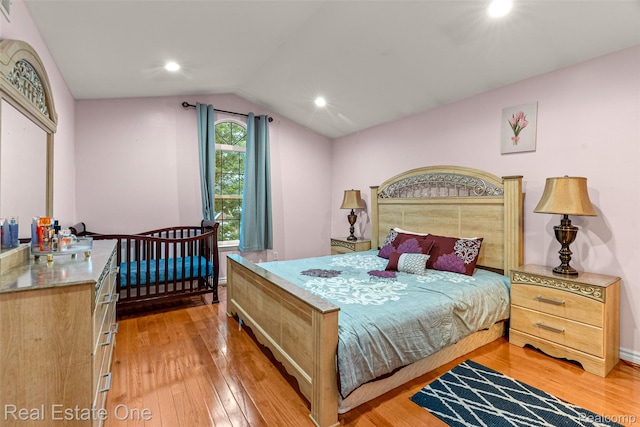 5410 Argyle St, Dearborn, MI 48126 - bedroom with light wood-style floors, vaulted ceiling, and recessed lighting
