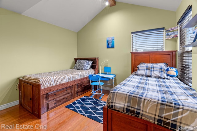 5410 Argyle St, Dearborn, MI 48126 - bedroom featuring wood finished floors, vaulted ceiling, and baseboards