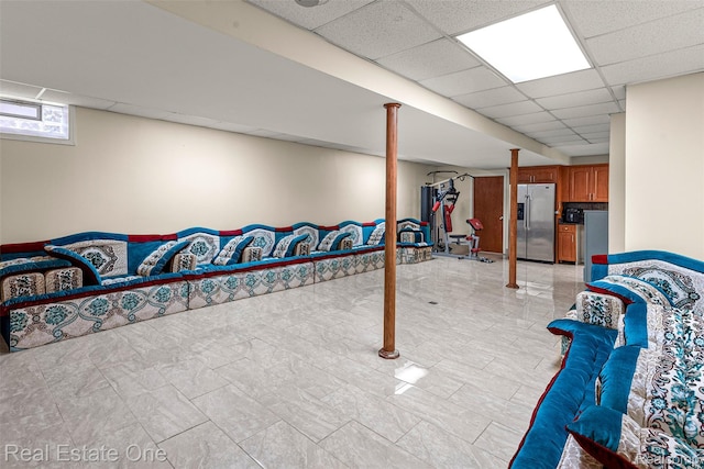 5410 Argyle St, Dearborn, MI 48126 - basement featuring stainless steel fridge, a paneled ceiling, and light marble finish flooring