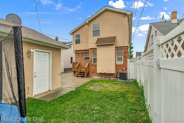 5410 Argyle St, Dearborn, MI 48126 - back of house with brick siding, cooling unit, and stucco siding
