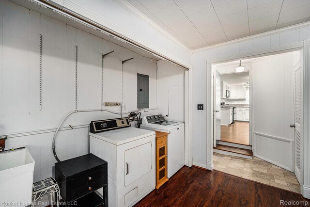 35825 Oakwood Ln, Westland, MI 48186 - laundry room with electric panel, washer and clothes dryer, crown molding, and wood finished floors
