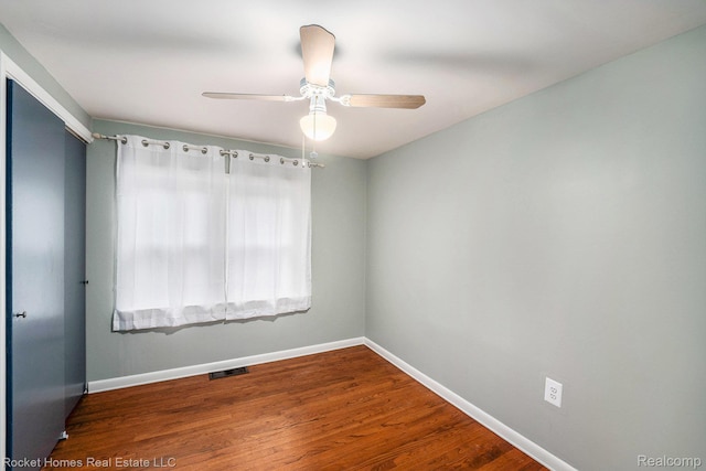 35825 Oakwood Ln, Westland, MI 48186 - unfurnished room with baseboards, wood finished floors, and ceiling fan