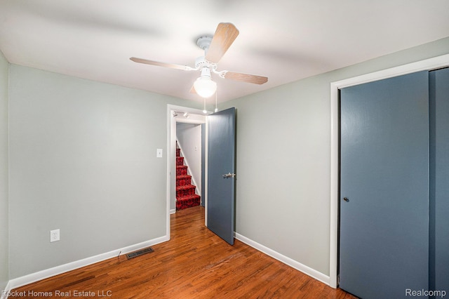 35825 Oakwood Ln, Westland, MI 48186 - unfurnished bedroom with baseboards, a closet, wood finished floors, and ceiling fan