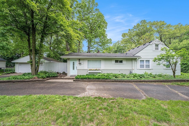 35825 Oakwood Ln, Westland, MI 48186 - view of front of house featuring a chimney and a detached garage