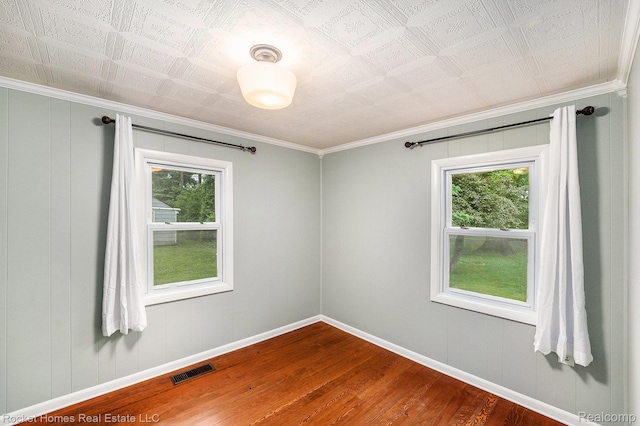 35825 Oakwood Ln, Westland, MI 48186 - spare room featuring dark wood-style flooring, ornamental molding, and baseboards