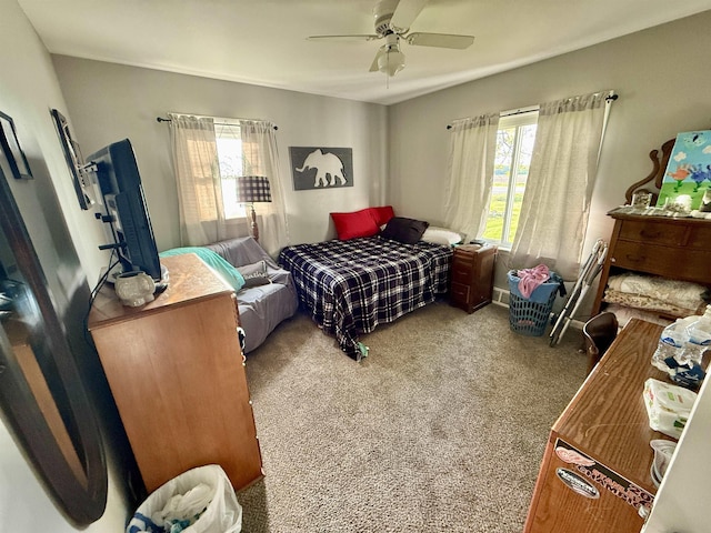 5547 Davison Rd, Davison, MI 48446 - carpeted bedroom featuring multiple windows and a ceiling fan