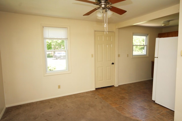 1772 E T Ave, Portage, MI 49002 - spare room with a ceiling fan and baseboards