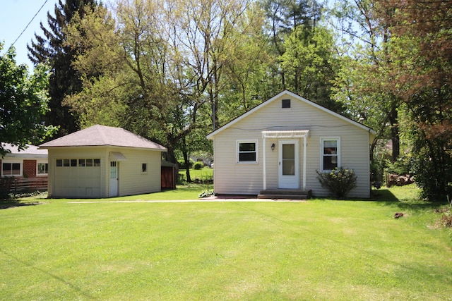 1772 E T Ave, Portage, MI 49002 - bungalow-style house featuring a garage, an outdoor structure, and a front lawn