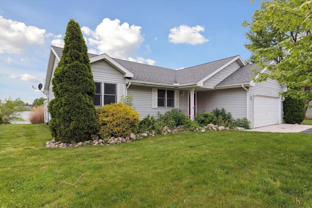 14814 Lark Dr, Camden, MI 49232 - ranch-style home with an attached garage, a front yard, roof with shingles, and concrete driveway