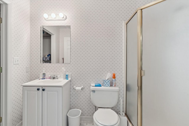 14814 Lark Dr, Camden, MI 49232 - bathroom featuring wallpapered walls, vanity, a stall shower, and toilet