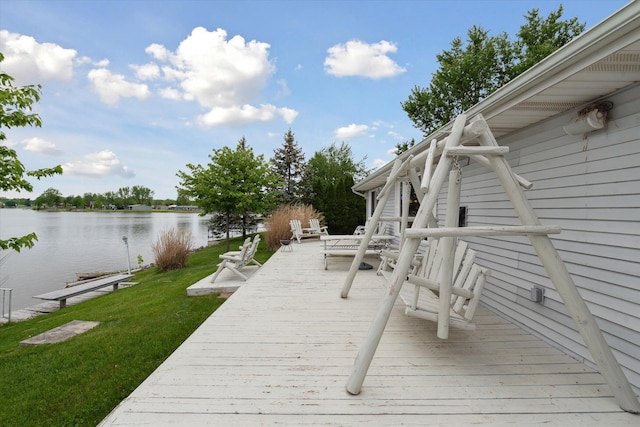 14814 Lark Dr, Camden, MI 49232 - wooden deck featuring a water view and a lawn