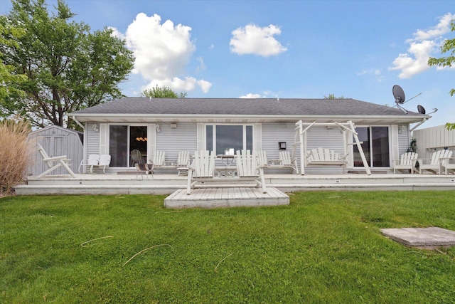 14814 Lark Dr, Camden, MI 49232 - back of property featuring a wooden deck and a lawn