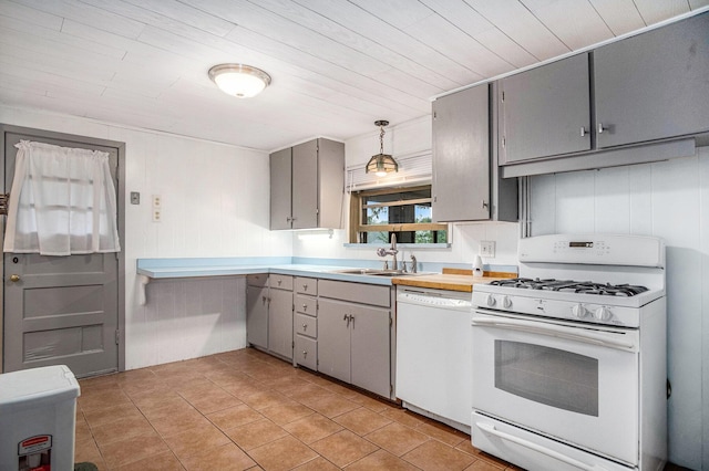 12948 Sandyside Dr, Gowen, MI 49326 - kitchen with white appliances, gray cabinetry, a sink, light countertops, and light tile patterned flooring