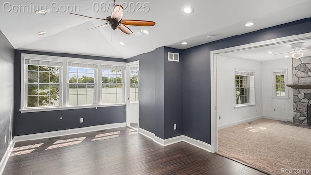 6288 Buckshore Dr, Whitmore Lake, MI 48189 - empty room featuring ceiling fan, healthy amount of natural light, a fireplace, baseboards, and recessed lighting