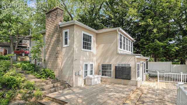 6288 Buckshore Dr, Whitmore Lake, MI 48189 - view of home's exterior with a chimney