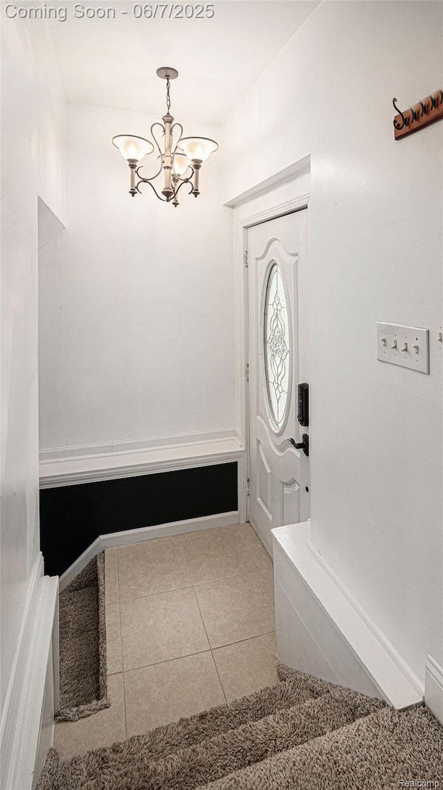 6288 Buckshore Dr, Whitmore Lake, MI 48189 - mudroom featuring a chandelier and tile patterned flooring