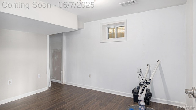 6288 Buckshore Dr, Whitmore Lake, MI 48189 - empty room featuring dark wood finished floors and baseboards