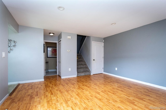 37331 Clubhouse Dr, Sterling Heights, MI 48312 - spare room featuring stairway, light wood-type flooring, baseboards, and recessed lighting