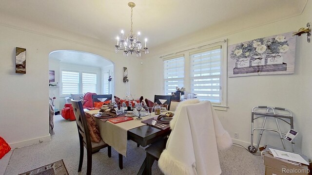 416 Marquette St, Flint, MI 48504 - dining area with arched walkways, baseboards, and a chandelier