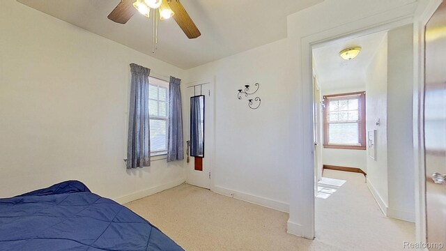 416 Marquette St, Flint, MI 48504 - bedroom with light colored carpet, baseboards, and a ceiling fan