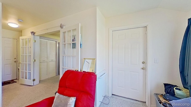 416 Marquette St, Flint, MI 48504 - living area with french doors and carpet flooring
