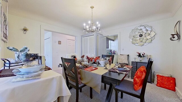 416 Marquette St, Flint, MI 48504 - dining room featuring a chandelier and carpet