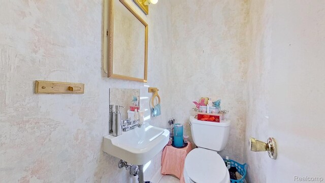 416 Marquette St, Flint, MI 48504 - half bathroom with toilet and a sink
