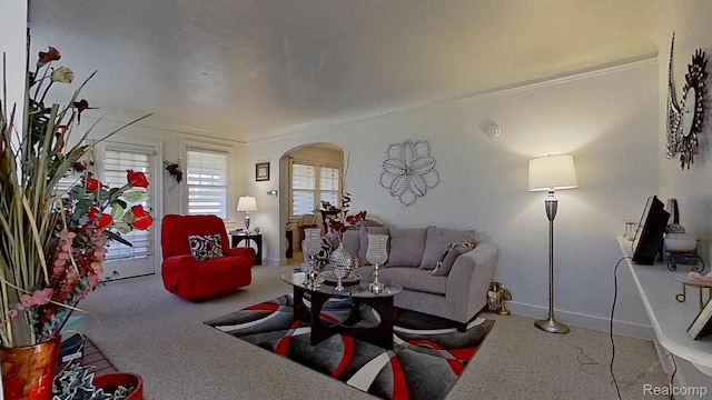 416 Marquette St, Flint, MI 48504 - carpeted living room featuring arched walkways and baseboards