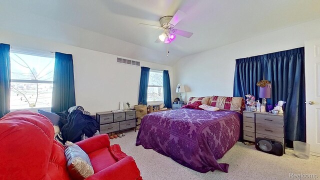 416 Marquette St, Flint, MI 48504 - bedroom featuring carpet floors, vaulted ceiling, and ceiling fan