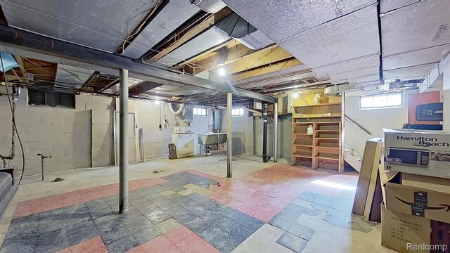 416 Marquette St, Flint, MI 48504 - basement featuring tile patterned floors and a sink