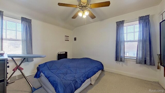 416 Marquette St, Flint, MI 48504 - bedroom with baseboards, multiple windows, and carpet