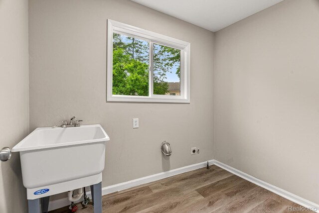 4766 Quarton Rd, Bloomfield, MI 48302 - laundry room featuring hookup for an electric dryer, wood finished floors, and baseboards