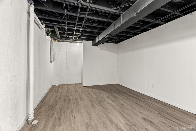 4766 Quarton Rd, Bloomfield, MI 48302 - finished basement with wood finished floors, baseboards, and electric panel