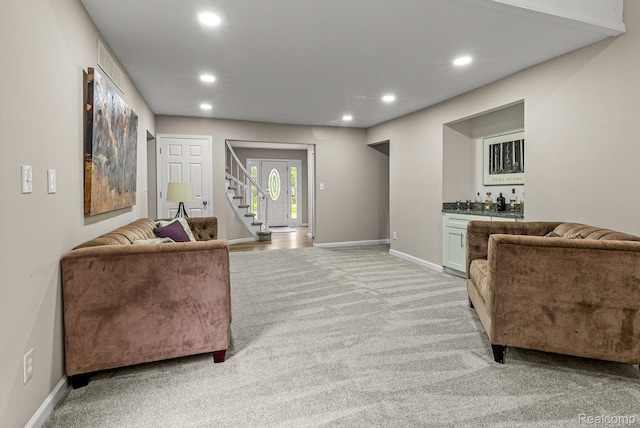 4766 Quarton Rd, Bloomfield, MI 48302 - living area featuring light colored carpet, stairway, recessed lighting, a bar, and baseboards