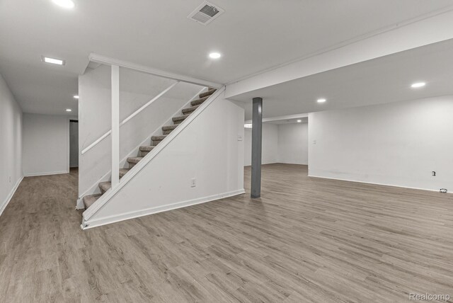 4766 Quarton Rd, Bloomfield, MI 48302 - finished basement with wood finished floors, stairway, recessed lighting, and baseboards