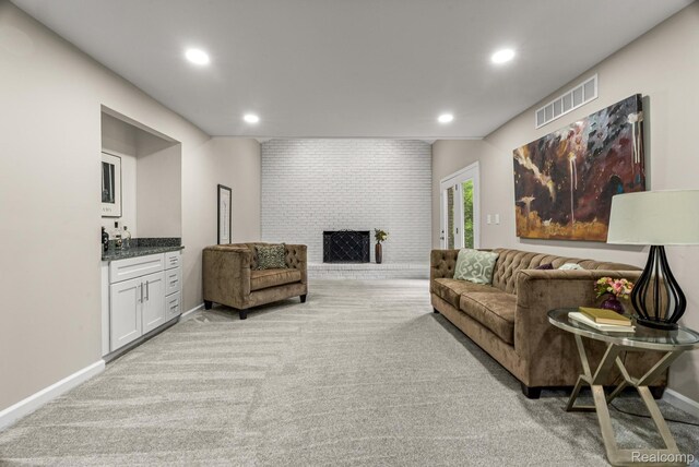 4766 Quarton Rd, Bloomfield, MI 48302 - living room with light colored carpet, recessed lighting, baseboards, and a fireplace