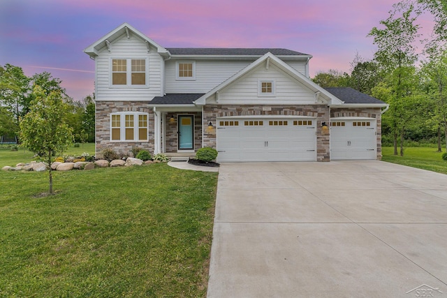 7302 Geraldine Cir, Swartz Creek, MI 48473 - view of front of house featuring concrete driveway, a front lawn, stone siding, an attached garage, and a shingled roof