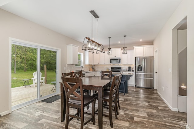 7302 Geraldine Cir, Swartz Creek, MI 48473 - dining space with dark wood-style flooring, baseboards, and recessed lighting