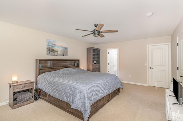 7302 Geraldine Cir, Swartz Creek, MI 48473 - bedroom with light carpet, baseboards, ceiling fan, and ensuite bathroom