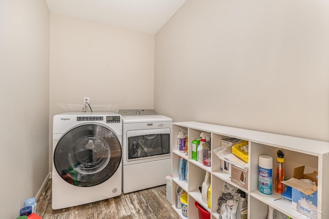 7302 Geraldine Cir, Swartz Creek, MI 48473 - laundry area featuring washer and clothes dryer and wood finished floors