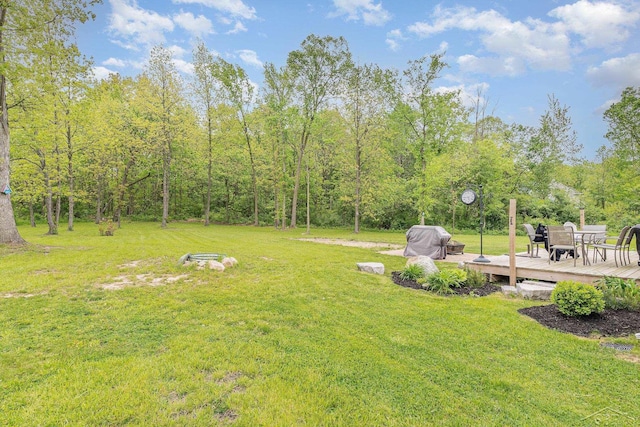 7302 Geraldine Cir, Swartz Creek, MI 48473 - view of green lawn featuring a wooden deck