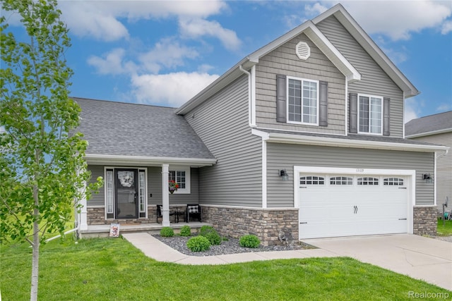 13109 River Rock Pass, Linden, MI 48451 - view of front of house with a front yard, stone siding, concrete driveway, and an attached garage